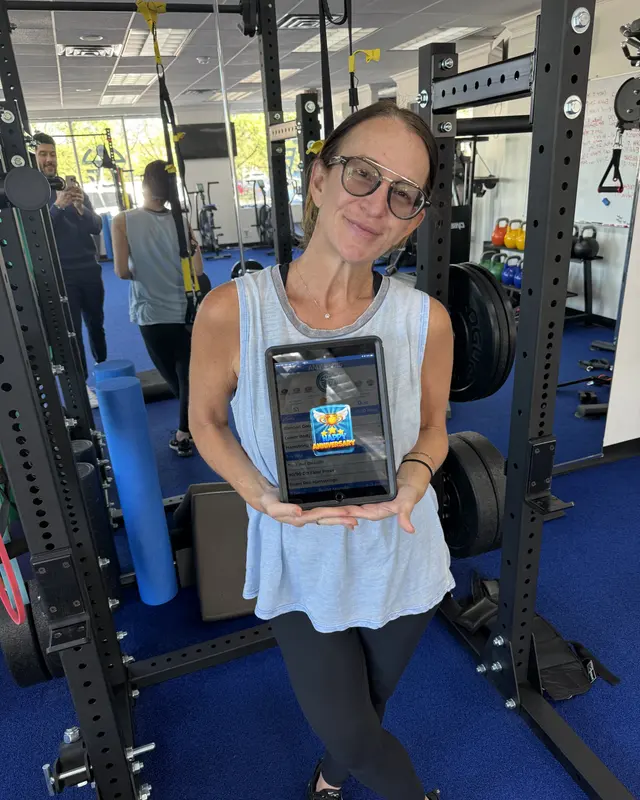 A Fravola Fitness member celebrating a training milestone