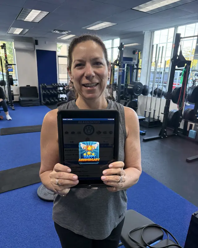 A Fravola Fitness member celebrating a training milestone