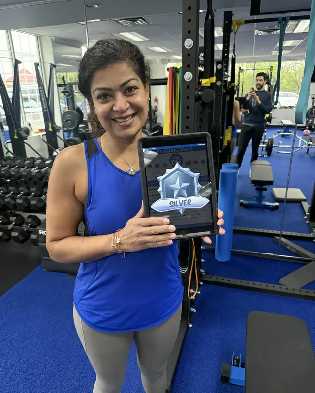 A Fravola Fitness member celebrating a Silver level-up