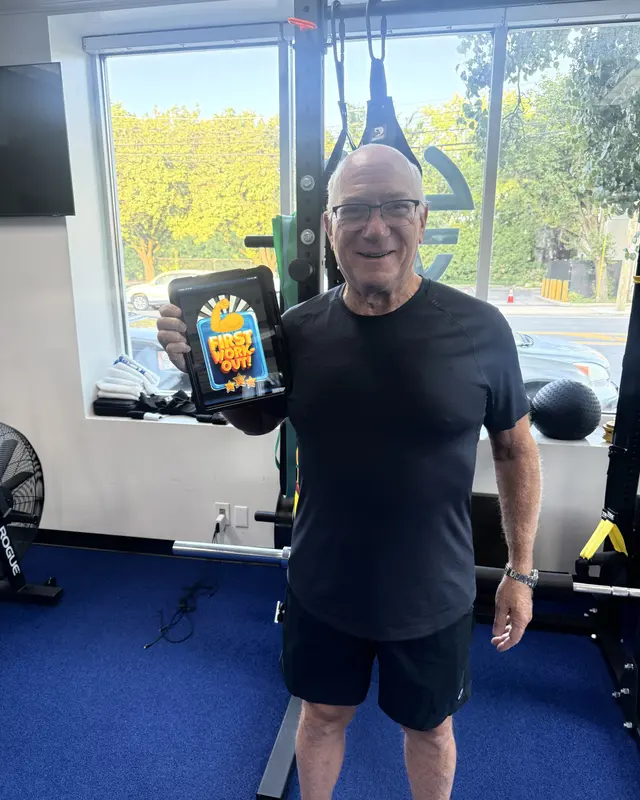 A Fravola Fitness member celebrating a training milestone